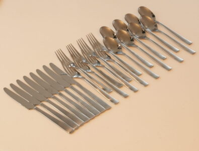 Complete stainless steel cutlery set at Canal Villa Otaru with knives, forks, and spoons arranged neatly for guest dining convenience.