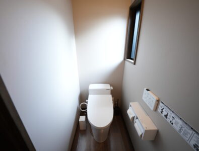 Clean modern washlet toilet room at Enishiya Izumo Villa with electronic bidet controls, natural lighting, and minimalist design.